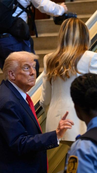Trump on escalator wagging finger
