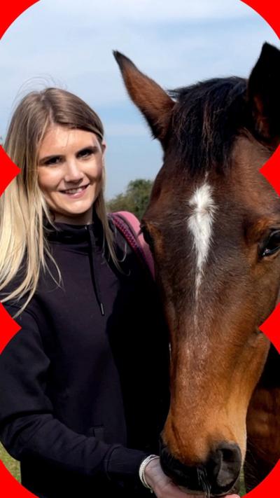 Poppy Beech, a woman with long blonde hair stands next to a horse, its head lowered next to Poppy
