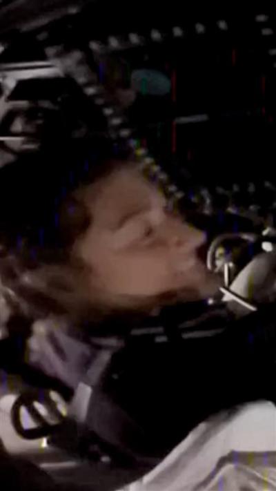 Astronaut smiling in a spaceship