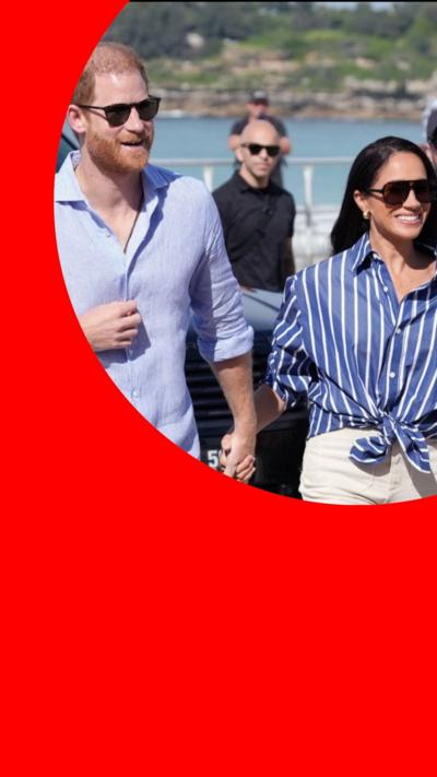 Harry and Meghan holding hands