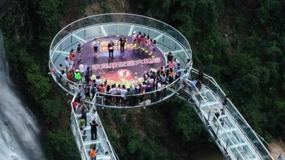Glass Bridge Featuring Circular Glass Observation Deck Opens In Guangdong