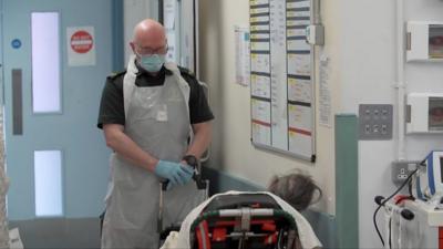 Patient waits on trolley in emergency department