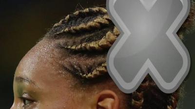 Blacks woman wears hair in cornrows