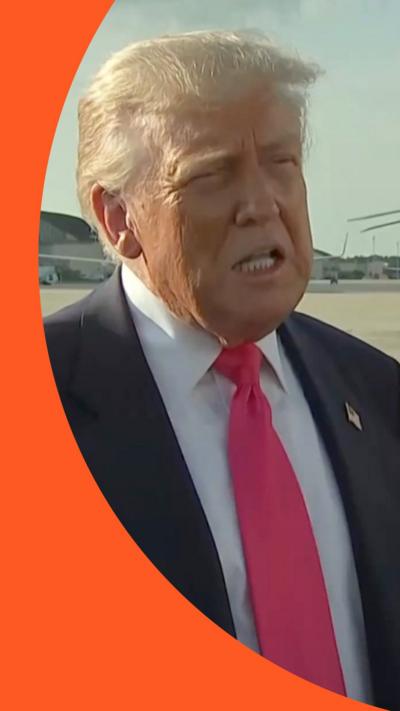 Donald Trump speaks on  the tarmac of an airport
