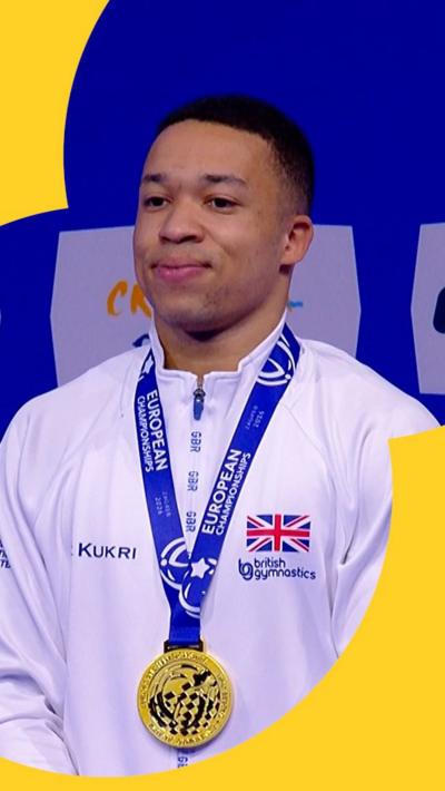 Joe Fraser stood proudly with a gold medal around his neck