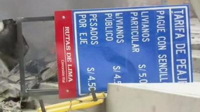 Felled toll booth sign