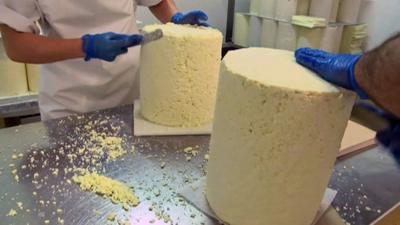 stilton cheese being prepared
