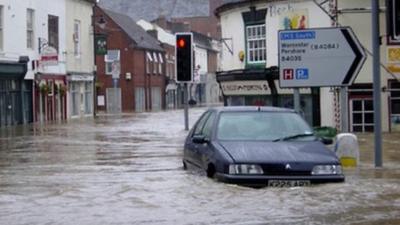 A car in a flooded road