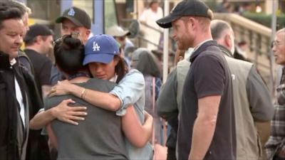 Meghan hugs woman in Pasadena