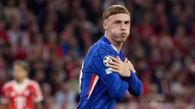 Chelsea's Cole Palmer celebrates by crossing his arms and acting cold