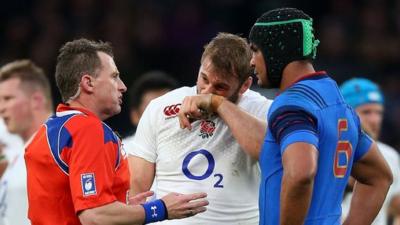 Nigel Owens in discussion with England captain Chris Robshaw and France's Thierry Dusautoir