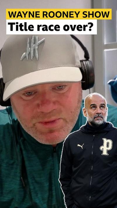 Wayne Rooney with a photo of Pep Guardiola looking frustrated