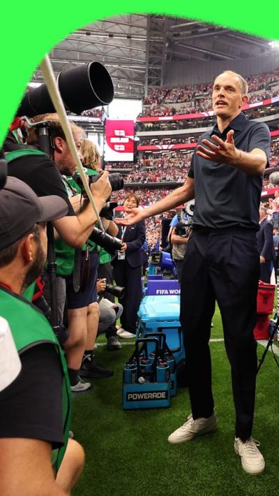 Thomas Tuchel gestures at photographers