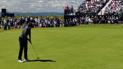 Rory McIlroy sees his putt slip past the hole on the 13th at Troon on Thursday