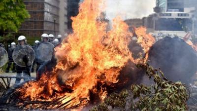 Hay set alight in protest