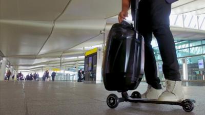 A suitcase with a built-in scooter