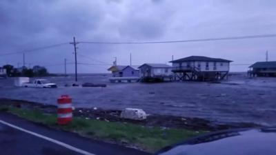 Houses on stilts are seen amidst heavy flooding