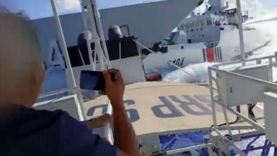 Chinese Coast Guard tailing very close to a Philippine vessel