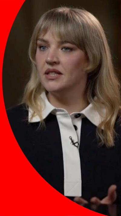 Singer Self Esteem looks to the left