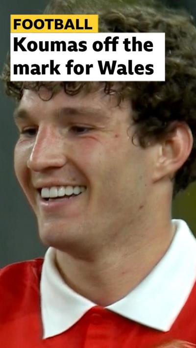 Lewis Koumas smiles after scoring