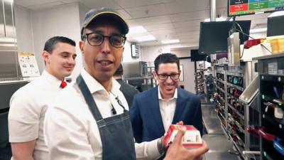 BBC's Kamal Ahmed making a burger