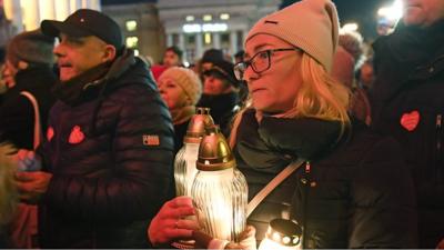 Woman holds candle