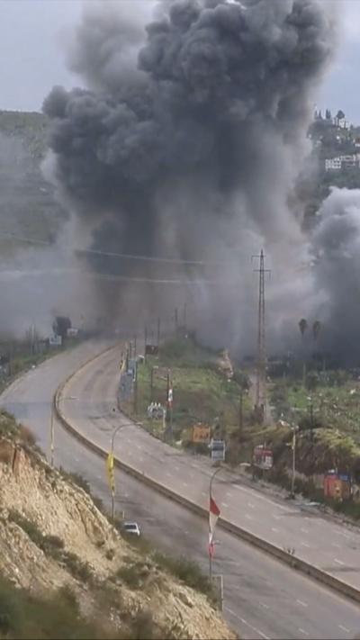 Smoke and flames rise after an Israeli strike targeting the Qasmiya Bridge near Tyre, in southern Lebanon