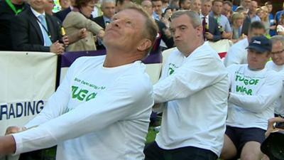 Parliamentary tug of war team with reporter Giles Dilnot