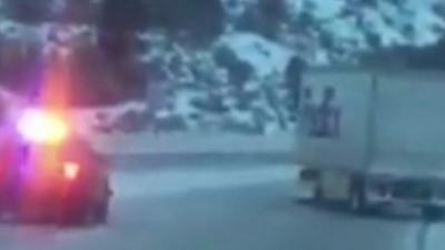 Still from dashcam footage shows truck sliding down the I-80 in California