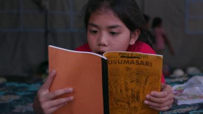 Girl reads book