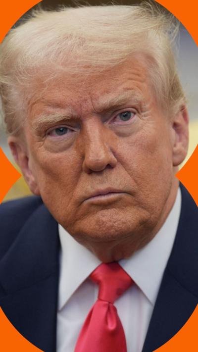 Donald Trump, wearing a red tie and suit, looking serious.