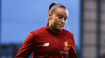 Natasha Harding in a Liverpool football kit