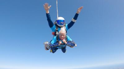 Manette Baillie and instructor skydiving