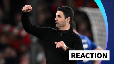 Mikel Arteta celebrates with one arm in the air and a clenched fist 