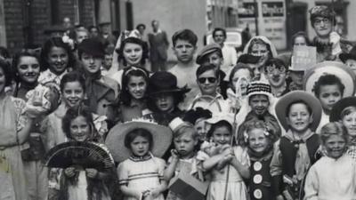 A group of school children celebrating a coronation 70 years ago