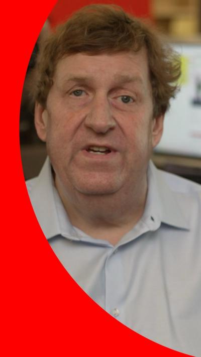 Gary O'Donoghue in the BBC's DC newsroom, with a computer behind him showing the BBC website
