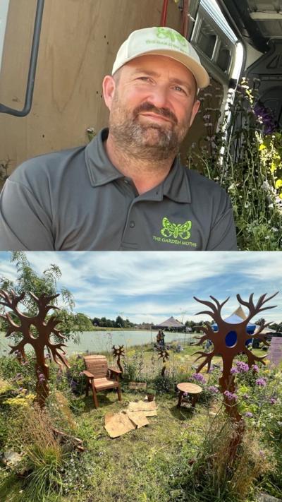 The top half of the image features Gavin Moth. He has a brown beard with flecks of grey. He is wearing a white cap and a grey polo shirt. Both have a bright green butterfly logo on and the words 'The Garden Moths'. The bottom half of the image features a show garden. There are two large silhouette tree sculptures at the left and right hand side of the image and two more smaller ones in the centre at the back of the garden. There is a circle of tall grasses and plants with pink, white and yellow flowers. In the centre of the circle there is a lawn with a wooden chair and table on it.