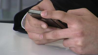 Child playing with mobile phone