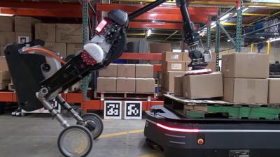 Robots working together in a warehouse