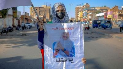 woman holding poster