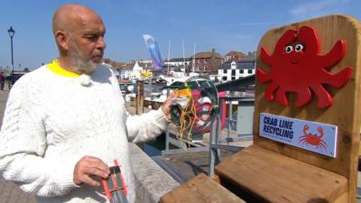 Crabbing recycling bin on Weymouth harbour