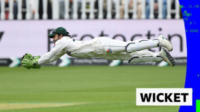 Muhammad Rizwan diving to catch Emilio Gay