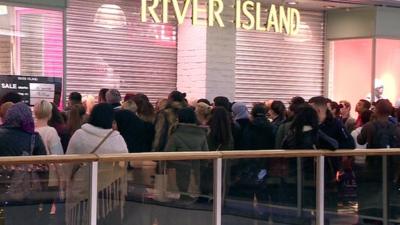 Shoppers outside River Island at Brent Cross