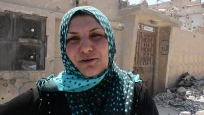 Um Louay and her nine children say returning to their partially destroyed house in the Syrian city of Raqqa is better than living in a camp.