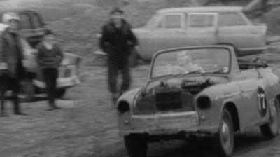 Man races old car around a quarry track
