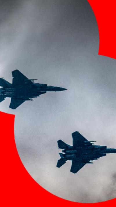 Two RAF jets in a cloudy sky.