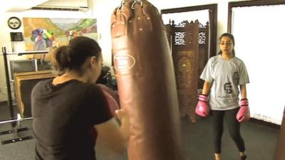 Women kick-boxing in Saudi Arabia