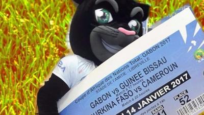 Afcon 2017 mascot holding an over-sized match ticket