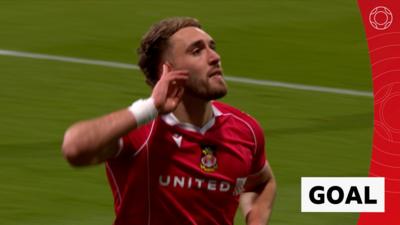 Sam Smith celebrates his goal against Chelsea with one hand cupped beside his ear
