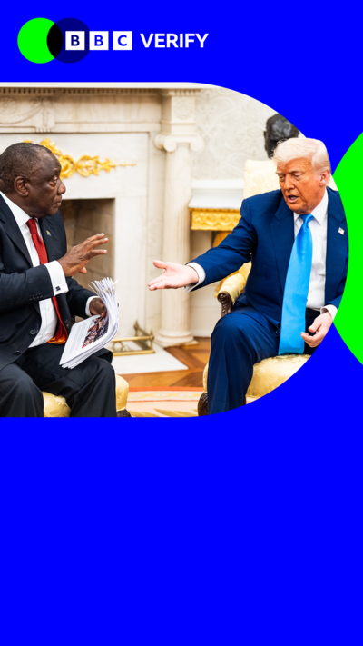 Donald Trump speaks with South Africa's President Cyril Ramaphose. Trump is extending a hand and is wearing a dark suit and blue tie. Ramaphosa is wearing a dark suit and red tie. 